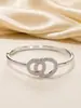Pulsera Doble Aro Entrelazado Incrustada con Circonita Diseño de Alta Gama Temperamento de Moda Souvenir de Confesión Versátil Viaje Diario Muestra Exquisito