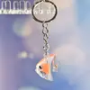 Nuevo Colgante Creativo de Bolsa con Cara Sonriente de Pulpo Brillante Dibujo Animado Pequeño Regalo Llavero de Moda Anillo de Llave