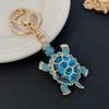 Llavero de metal de tortuga linda con diamante de color transfronterizo, regalos creativos, ventas directas de fábrica de pequeños productos básicos de Yiwu