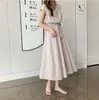 Vestido Artístico Acampanado 2026 Verão Novo Estilo Cintura Marcada Solto Tamanho Grande Vestido de Algodão e Linho