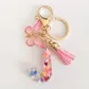 2024 transfronterizo en stock rosa lentejuelas resina 26 letras inglesas llavero colgante mariposa borla accesorios