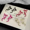 Nuevos aretes de lazo de cinta transfronterizos, aretes simétricos de moda, aretes del mismo estilo más vendidos en Amazon, venta al por mayor del fabricante