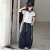 Conjunto de Verano para Niñas 2026 Nuevo Conjunto Casual Estilo Coreano para Niños Mayores con Mangas Cortas Rayadas y Pantalones de Secado Rápido