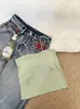 Camisola sin costuras de seda helada de longitud media sin tirantes para mujer con almohadillas en el busto, espalda hermosa, bordes ondulados y diseño anti-exposición