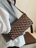 Bolsa de lunares de nicho súper popular para primavera y verano para mujer 2026 Nuevo Bolso cruzado versátil retro Bolso de un solo hombro de axila Bolso cilíndrico