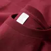 Al por mayor 230 gramos de camiseta blanca de algodón con hombros caídos pesados, manga corta, para hombre y mujer, color liso suelta, camiseta básica de marca de moda