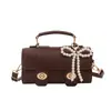 Versátil Bolso Nuevo para Mujer 2026 Nueva Moda Estilo Retro Bolso de Mano Cuadrado Pequeño con Acabado de Alta Gama, Bolso de Hombro y Cruzado