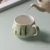 A nova caneca de cerâmica com melancia pintada à mão da Miyan é uma caneca de escritório de alto valor com alça, adequada para o chá da tarde ou café.