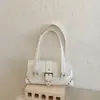 Bolsa casual de nicho estilo coreano transfronteiriça para mulheres, novo modelo 2026, bolsa de ombro sob o braço de grande capacidade, bolsa baguette de mão
