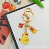 Llavero Colgante Año Nuevo 2026 Metal Zodiaco León Dorado Petardo Despertar Bolsa de la Fortuna Colgante Evento Pequeño Regalo