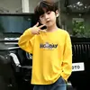Camiseta de moda de manga larga 100% algodón para niños, nuevo modelo primavera 2026, top sencillo de dibujos animados para niños mayores y pequeños