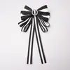 Estilo transfronterizo más vendido broche de corsage con lazo de pedrería a rayas decoración para camisa corbata cuello accesorios de flor