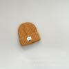 Traje de punto para niños estilo occidental sombrero de pompón bufanda conjunto de dos piezas niños y niñas invierno exterior a prueba de frío sombrero de punto