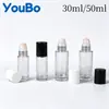Botella dispensadora de aceite de ricino de vidrio transparente de 30 ml y 50 ml Botella con rodillo de jade de cristal rosa natural Botella con rodillo de cuarzo rosa
