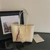 Nueva bolsa de hombro retro minimalista 2026 para mujer, gran capacidad, casual, para ir al trabajo, bolso de mano con textura tejida