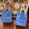 Bolsa de Regalo de Primavera Transfronteriza, Bolsa de Regalo de Tarjeta Blanca, Bolsa de Compras Grande con Asa para Empaque de Regalos, Bolsa de Hombro Engrosada