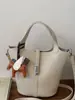 Bolsa Balde Cesta da Moda para Mulheres 2025 Outono Nova Bolsa de Ombro de Alto Valor Bolsa Transversal Niche de Cor Sólida Simples