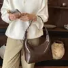 Bolsa de ombro transfronteiriça de alta qualidade para mulheres, nova moda outono 2026, bolsa crossbody de couro macio, bolsa de mão versátil e bolsa de ombro