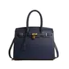 Bolso de mano retro de gran capacidad para mujer, nuevo estilo 2026, bolso de platino de moda transfronterizo, adecuado para ir al trabajo y uso casual, bolso cruzado Kelly