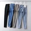 Pantalones lápiz ajustados asimétricos con hebilla oblicua de otoño para adelgazar y realzar la cadera, jeans ajustados de talle alto para adelgazar