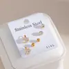 Pendientes de acero inoxidable transfronterizos europeos y americanos más vendidos para mujer, pendientes con forma de corazón chapados en oro con incrustaciones completas de diamantes, elegante y único conjunto de pendientes de tres piezas