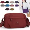 Bolsa transversal feminina multi-camadas, moderna e versátil, novo modelo da primavera 2026, bolsa de tecido de nylon simples e estilosa, bolsa de ombro casual
