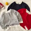 Camiseta Manga Longa Infantil T2026 Olhos Apertados Outono Novidades Meninos e Meninas Lisa Falsa Peça Dupla Camiseta para Bebê Gola Redonda Camisa Base