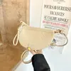 Bolso pequeño de tejido moderno y de moda para mujer, nuevo bolso retro de media luna de alto valor, bolso de hombro y cruzado para el día a día