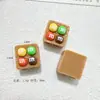 Accesorios de resina de frijoles de chocolate de caramelo de dibujos animados 3D, accesorios para el cabello DIY con pegamento de crema, colgantes para teléfono, hebillas de zapatos, venta al por mayor de accesorios pequeños