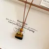 Colar com Pingente de Coração e Cruz de Resina com Pedra Olho de Tigre Retrô Corrente de Clavícula Estilo Étnico Design de Nicho para Mulheres