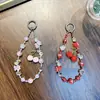 Cadena para Teléfono Móvil con Cuentas de Cereza Cadena Colgante para Bolso con Lazo de Cristal Lanyard de Perlas para Teléfono Móvil Regalo Pequeño Venta al por Mayor