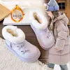 Botas de nieve para niños con forro polar y grosor extra, nuevo estilo invierno 2026, diseño lindo de lazo, botines cálidos, botas de algodón, cálidas