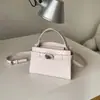 Bolso Pequeño con Patrón de Piedra Degradada para Mujer 2026 Nuevo Bolso Kelly Versátil de Mano Bolso Cruzado Versátil de Gama Alta para Primavera