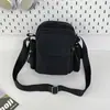 Bolsa para cámara popular transfronteriza con múltiples bolsillos, bolsa ligera de nailon resistente al agua, bandolera y cruzada casual unisex