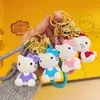 Lindo Llavero de Nudo de Lazo Gato Kt Figura de Resina Hello Kitty Colgante de Cuerda Trenzada Encanto Versátil de Bolsa de Dibujos Animados