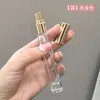 En stock venta al por mayor botella de perfume cilíndrica de vidrio de 10 ml botella para decantar portátil de viaje botella rociadora cosmética
