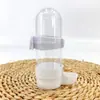 Fuente de agua para pájaros bebedero automático comedero para agua caja de comida para loros tarro de comida comedero transparente anti-salpicaduras ventas directas de fábrica