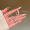 Pendientes de anillo liso exagerado con aguja de plata S925 de estilo europeo y americano para mujer, pendientes de temperamento simple Joker de lujo ligero de alta gama, venta al por mayor