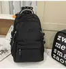Mochila de viaje versátil estilo coreano para parejas con bordado de letras, mochila escolar elegante y duradera para chicos de secundaria y preparatoria