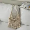 Bolso de hombro tejido floral de moda nicho, bolso tejido para el antebrazo para vacaciones en la playa, bolso tote ligero y elegante de color liso para la playa