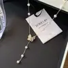 Colar de Flor Borboleta Pingente Pérola Concha para Mulheres 2026 Novo Alto Padrão Luxo Leve Nicho Corrente Clavícula Tendência