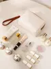 2025 nuevo ins de alta gama impermeable PU bolsa de maquillaje para mujer bolsa de almacenamiento de cosméticos bolsa de lavado de alto valor anís