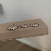 Anillo de estilo vintage de mediados de siglo con tiras cruzadas, diseño de nicho, juego de joyería de pendientes de circonita con incrustaciones de diamantes