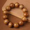 Venda por atacado direto do fabricante: Pulseiras Nan de Seda Dourada para Homens e Mulheres, Contas de Oração Budistas, Contas de Madeira Zhennan Folha Pequena, Contas de Oração, Disponível para Dropshipping
