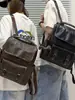 Mochila retro estilo británico con tapa abatible para pareja, adecuada para estudiantes universitarios, para llevar laptops y libros a clase, y para ir al trabajo o para viajes cortos.