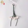 Nuevo colgante de bolso de flor de cuero y osmanthus dorado más vendido, mismo estilo que en Xiaohongshu, colgante de llavero al por mayor transfronterizo