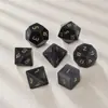 El Juego de Dados Poliédricos de Siete Piezas Z01 de Ojo de Gato Negro Sintético Más Vendido de Amazon para Juegos de Rol D&D con Números Tallados