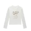 Camiseta de manga larga con cuello redondo y hombros rectos para mujer, nuevo estilo de primavera y otoño, estampado de gato de dibujos animados americano, moderna, versátil, top ajustado