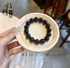 Pulseira de Obsidiana Negra Natural Anel Liso Obsidiana de Cristal Obsidiana Prateada Obsidiana de Gelo Olho de Gato Aumentador de Fortuna Unissex Atacado