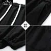 Novos Calças Casuais Esportivas de Fitness Elásticas Simples com Múltiplos Bolsos Estilo Coreano para Homens, Outono e Primavera, Tendência para Casais